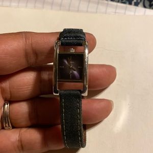 Fossil woman’s watch great condition, blue jean band, silver and purple facing.